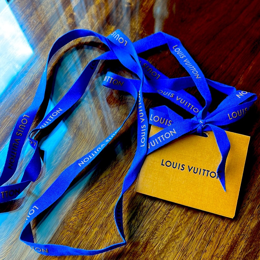 Louis Vuitton ribbon and blank card.